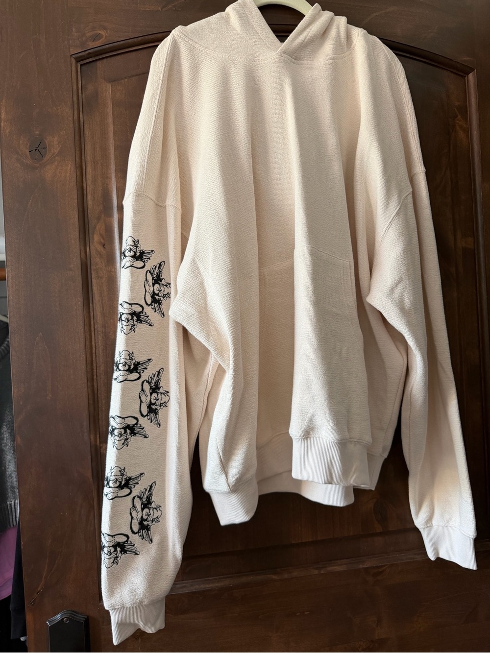 Boys Lie L/XL Cream Hoodie with Black Sleeve Graphics. NWT